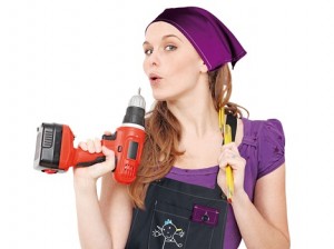 woman with drill doing home improvement